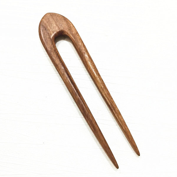 carved wooden hair pins